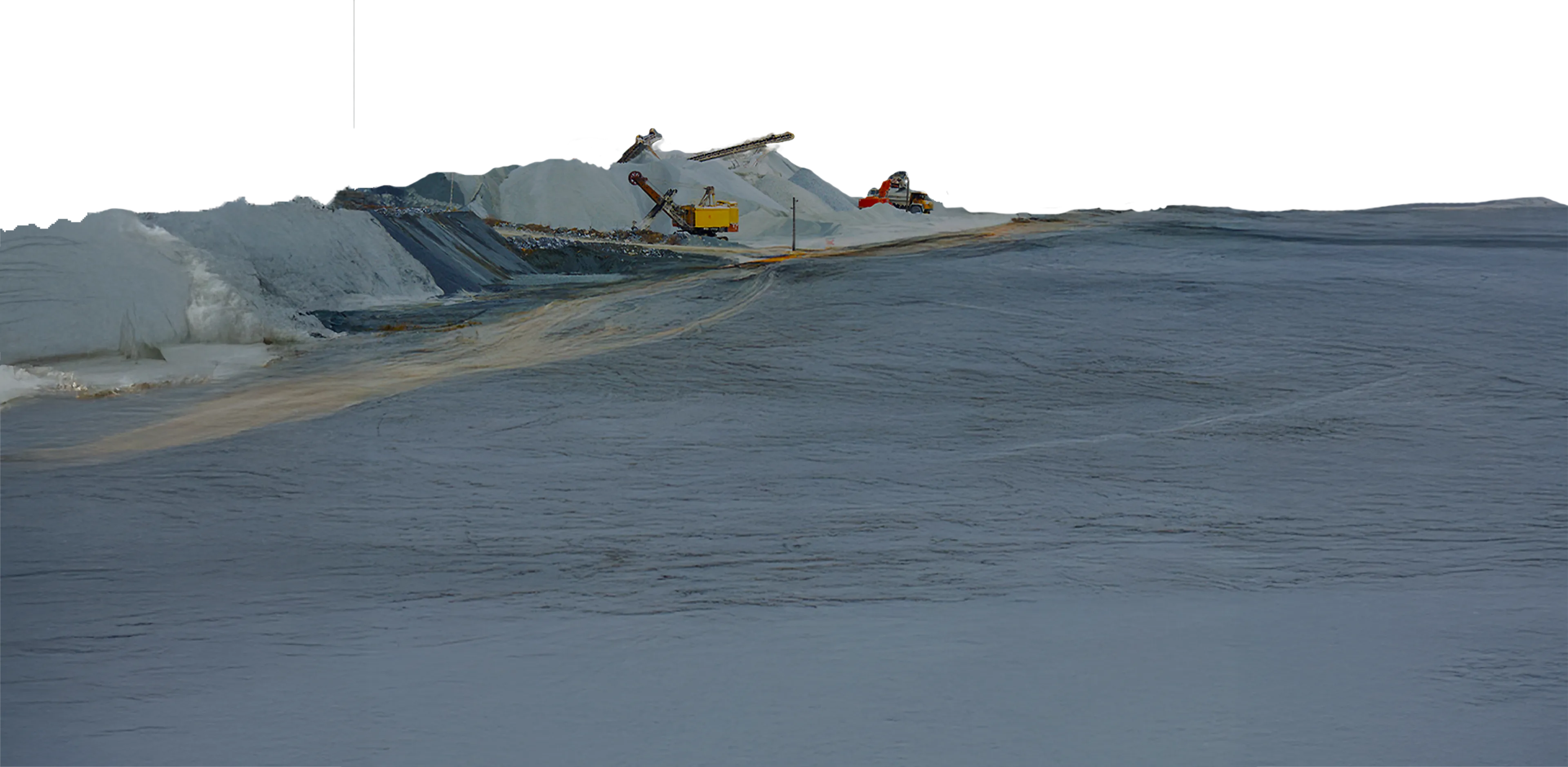 Mound with cranes and industrial vehicles